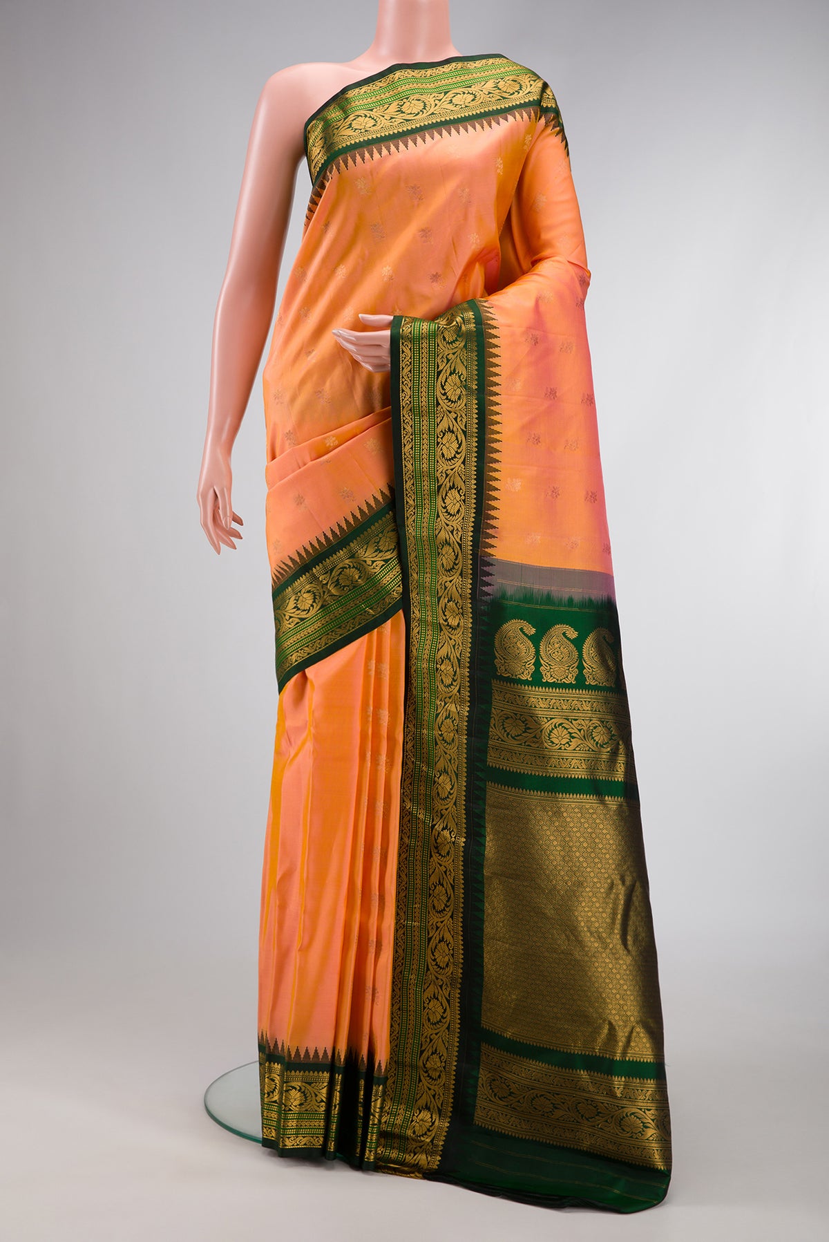 Peach Dual Tone Gadwal Silk Saree with Zari Butta on the body and Zari Border.  displayed on a mannequin