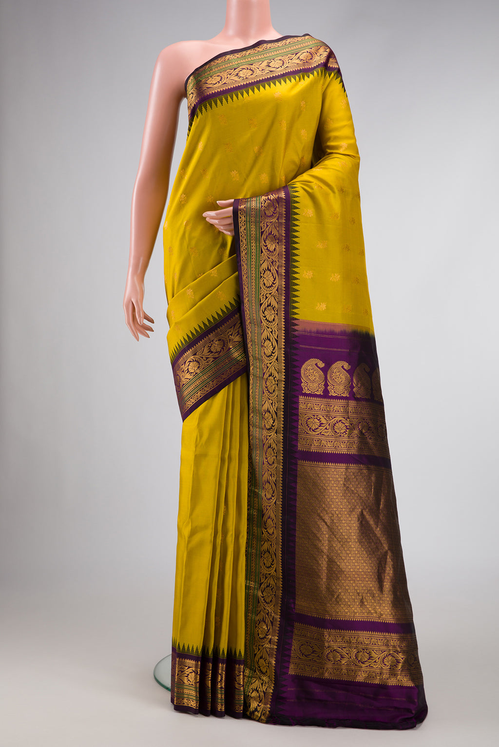 Mehandi Green Dual Tone Gadwal Silk Saree with Zari Butta on the body and Zari Border.  displayed on a mannequin