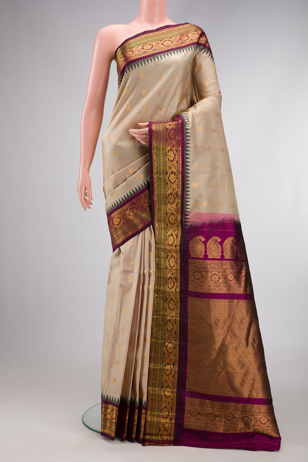 Beige Dual Tone Gadwal Silk Saree with Zari Butta on the body and Zari Border.  displayed on a mannequin
