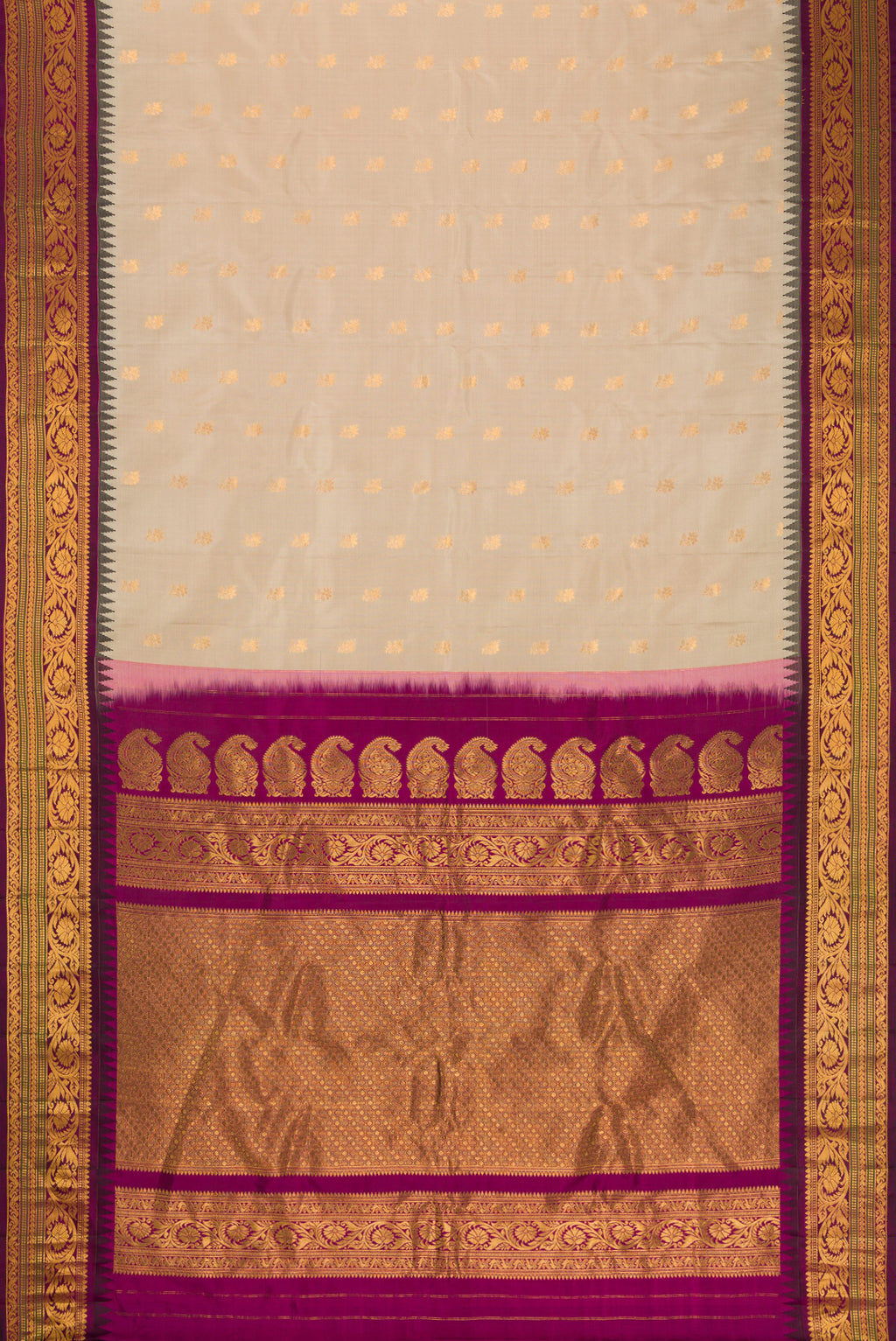 Flat view of Beige Dual Tone Gadwal Silk Saree with Zari Butta on the body and Zari Border. 