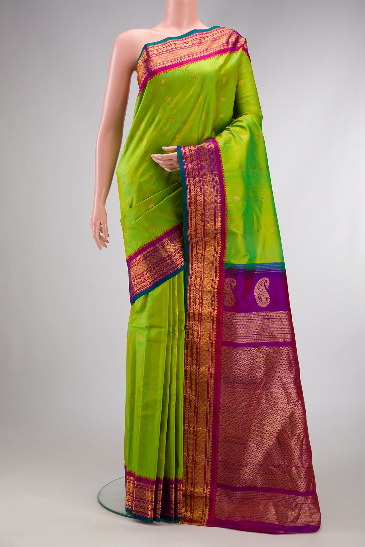 Parrot Green Dual Tone Gadwal Silk Saree with Zari Butta on the body and Zari Border.  displayed on a mannequin