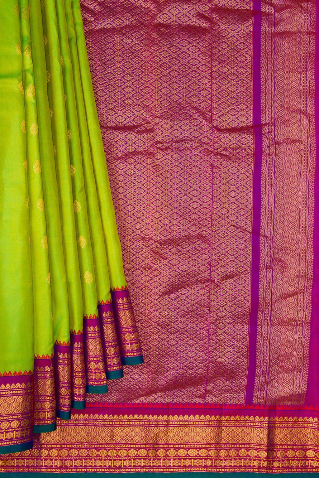 Pleats and pallu of Parrot Green Dual Tone Gadwal Silk Saree with Zari Butta on the body and Zari Border. 