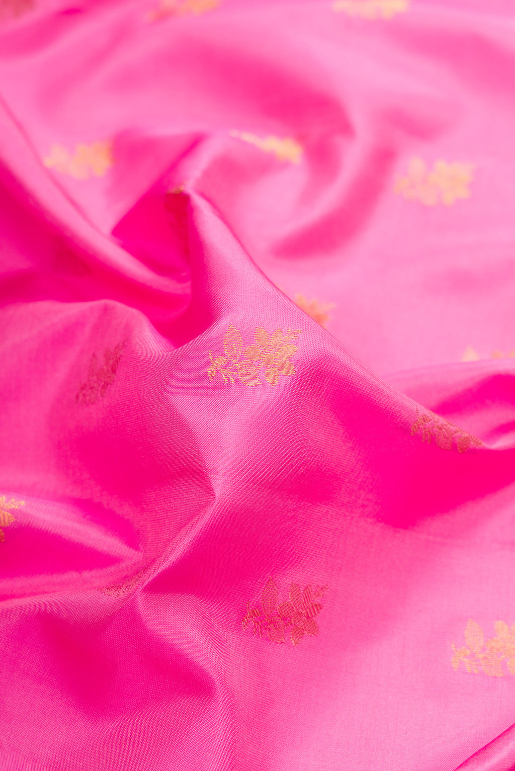 Close up of Pink Dual Tone Gadwal Silk Saree with Zari Butta on the body and Zari Border.  displaying folds