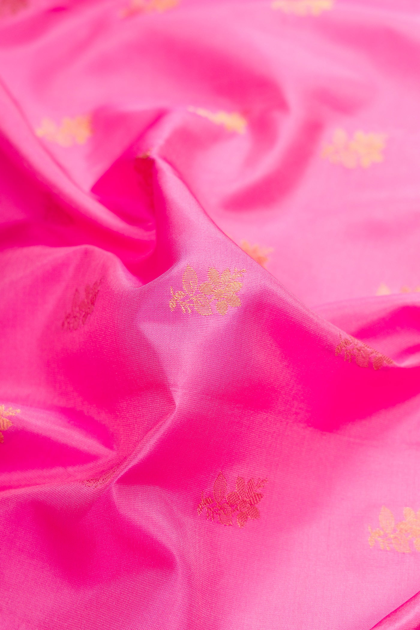 Close up of Pink Dual Tone Gadwal Silk Saree with Zari Butta on the body and Zari Border.  displaying folds