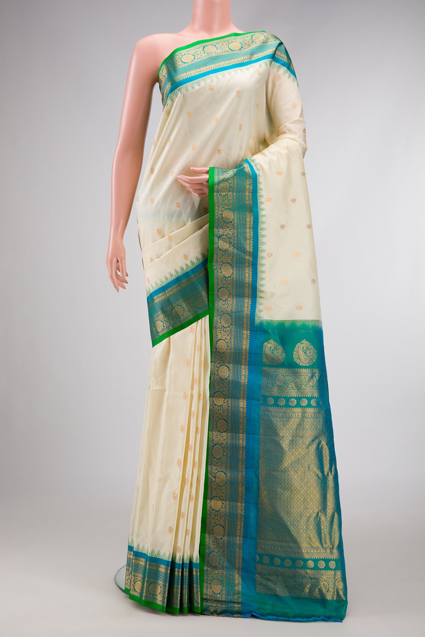 Off White Dual Tone Gadwal Silk Saree with Zari Butta on the body and Zari Border.  displayed on a mannequin