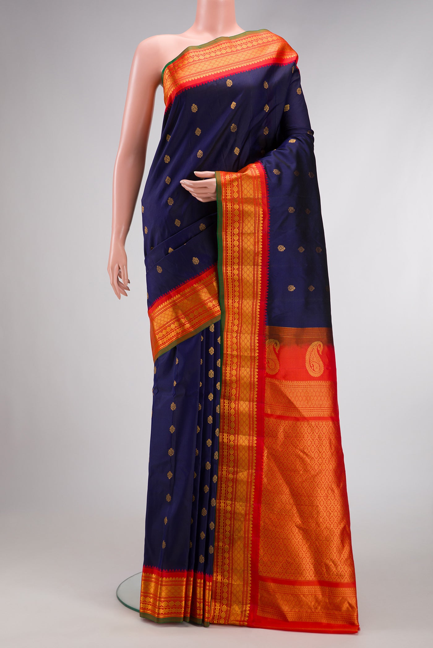 Navy Blue Dual Tone Gadwal Silk Saree with Zari Butta on the body and Zari Border.  displayed on a mannequin
