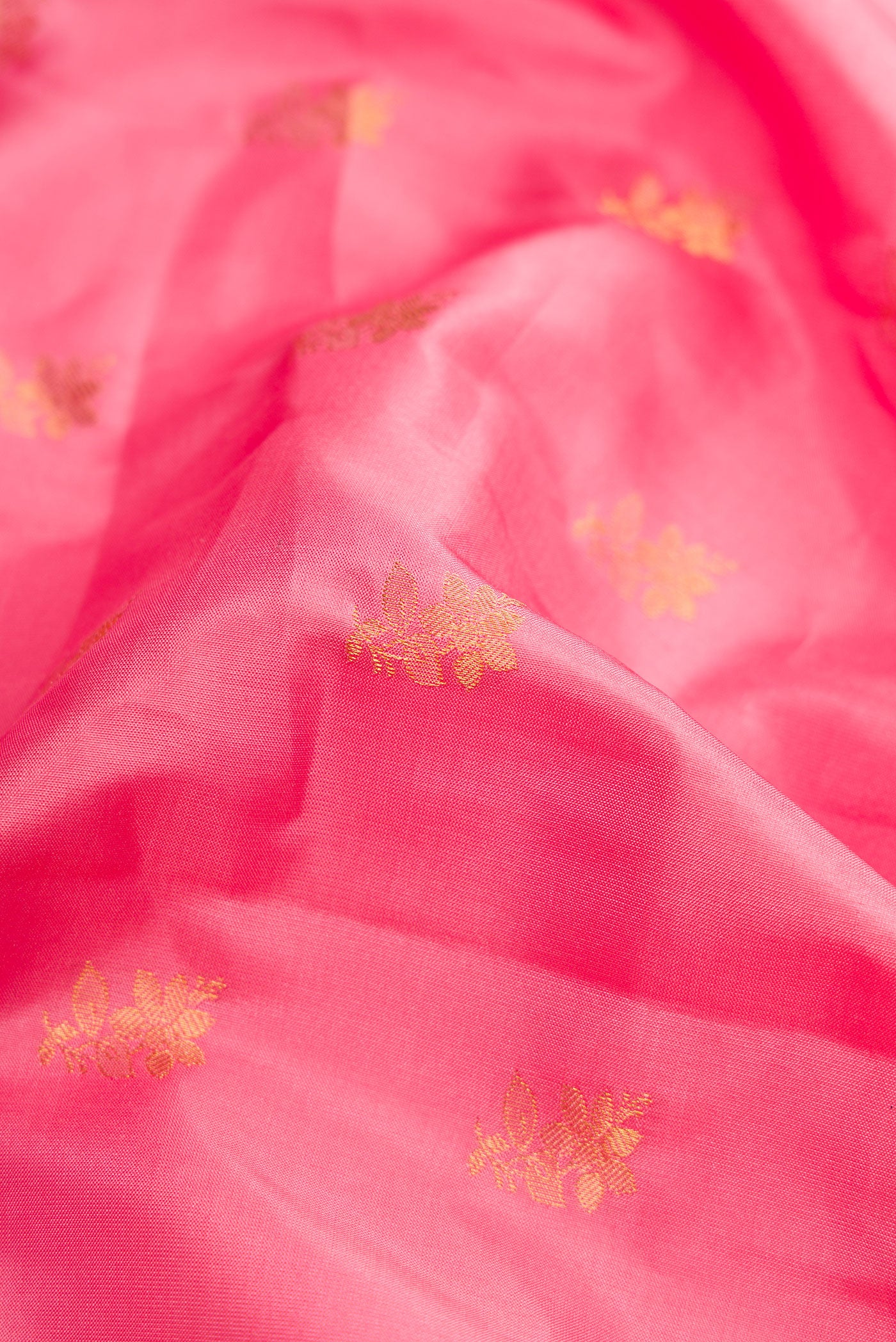 Close up of Pink Dual Tone Gadwal Silk Saree with Zari Butta on the body and Zari Border.  displaying folds