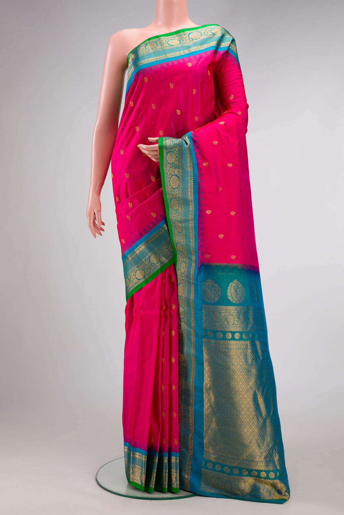 Dark Pink Dual Tone Gadwal Silk Saree with Zari Butta on the body and Zari Border.  displayed on a mannequin