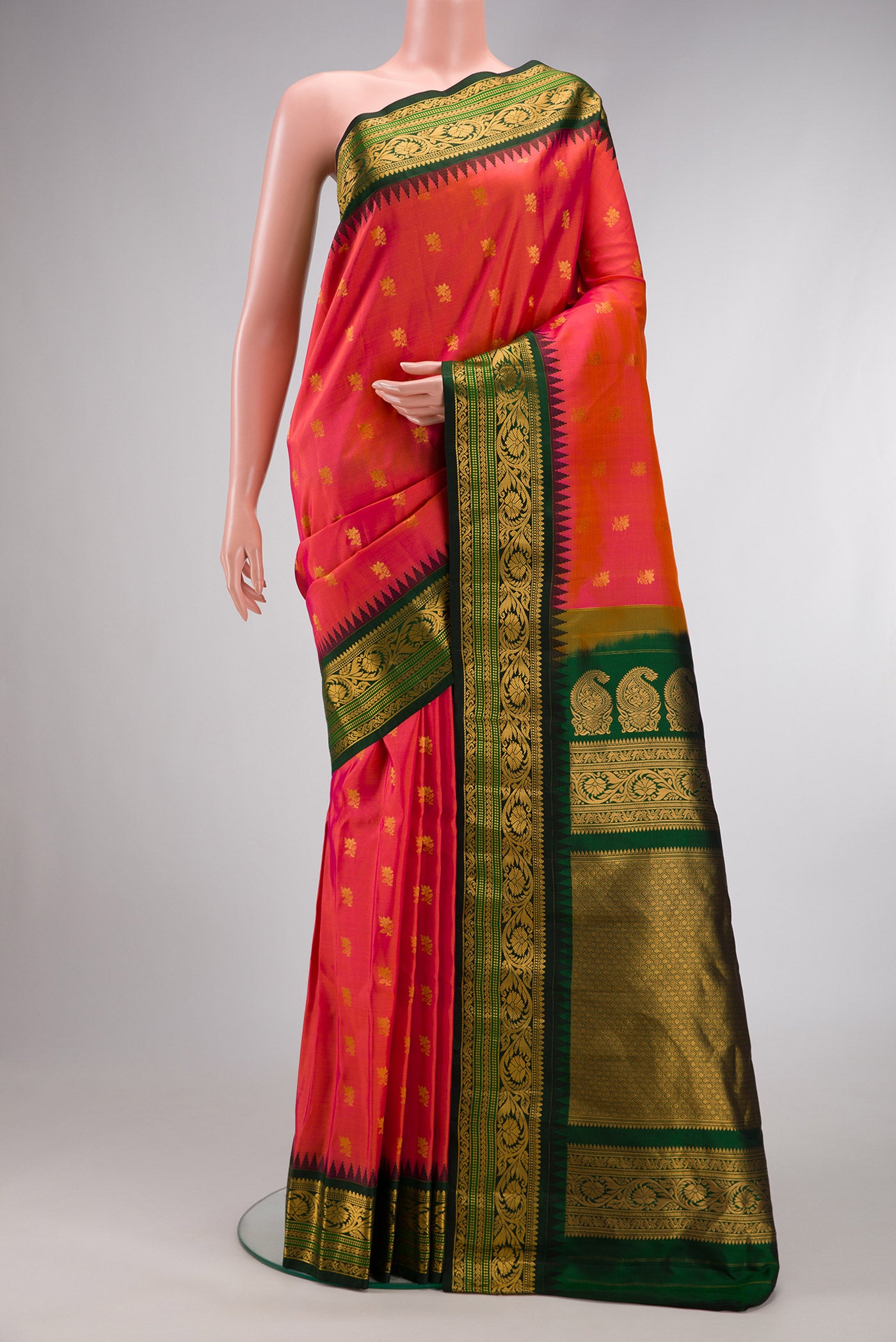 Coral Dual Tone Gadwal Silk Saree with Zari Butta on the body and Zari Border.  displayed on a mannequin