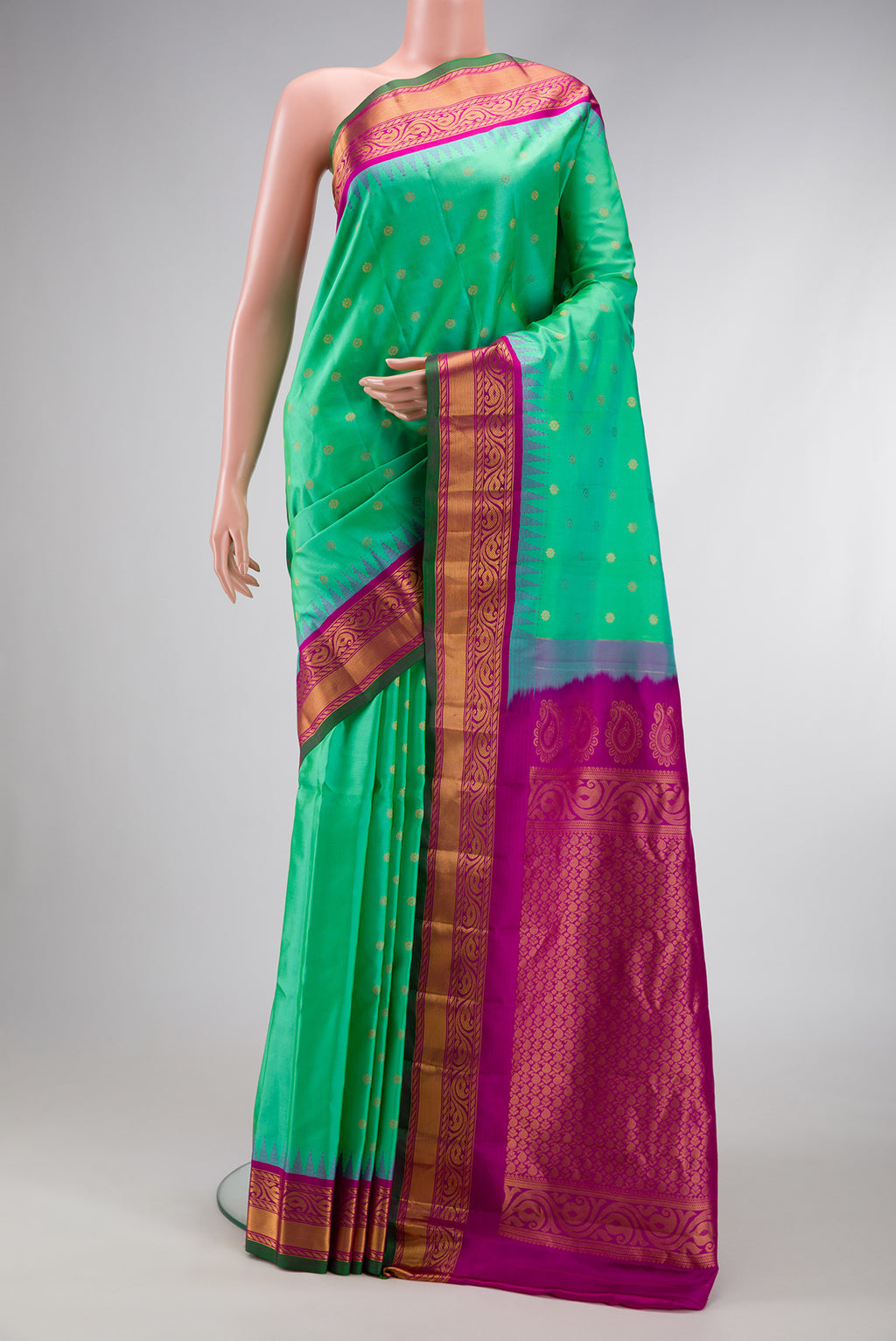 Sea Green Dual Tone Gadwal Silk Saree with Zari Butta on the body and Zari Border.  displayed on a mannequin