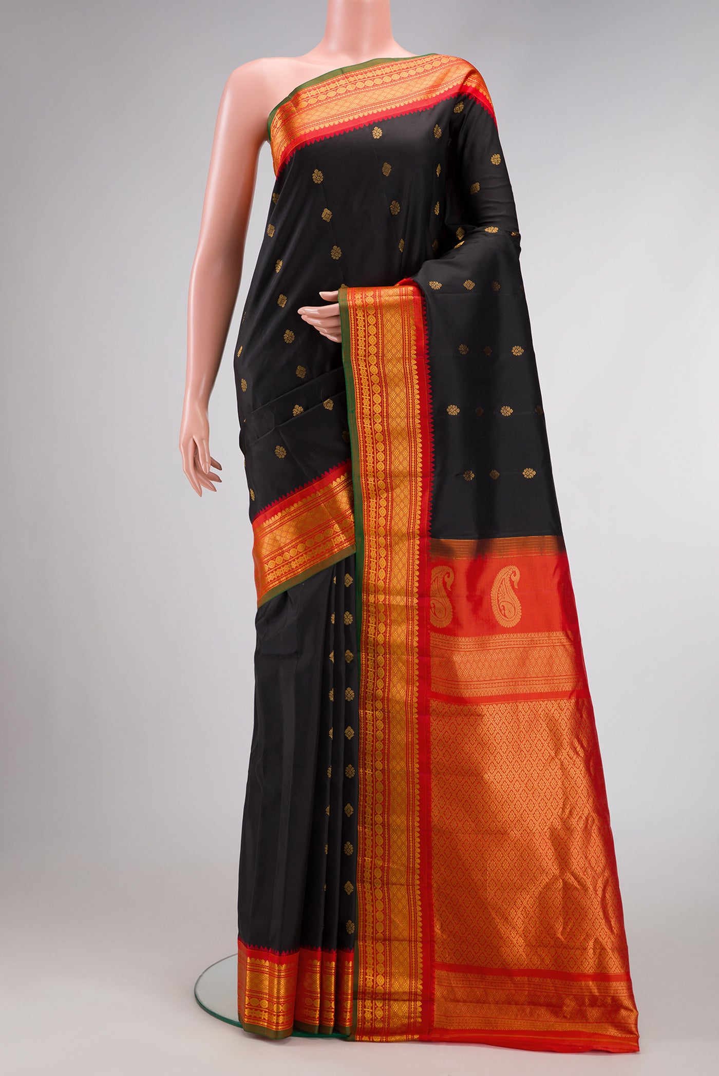 Black Dual Tone Gadwal Silk Saree with Zari Butta on the body and Zari Border.  displayed on a mannequin