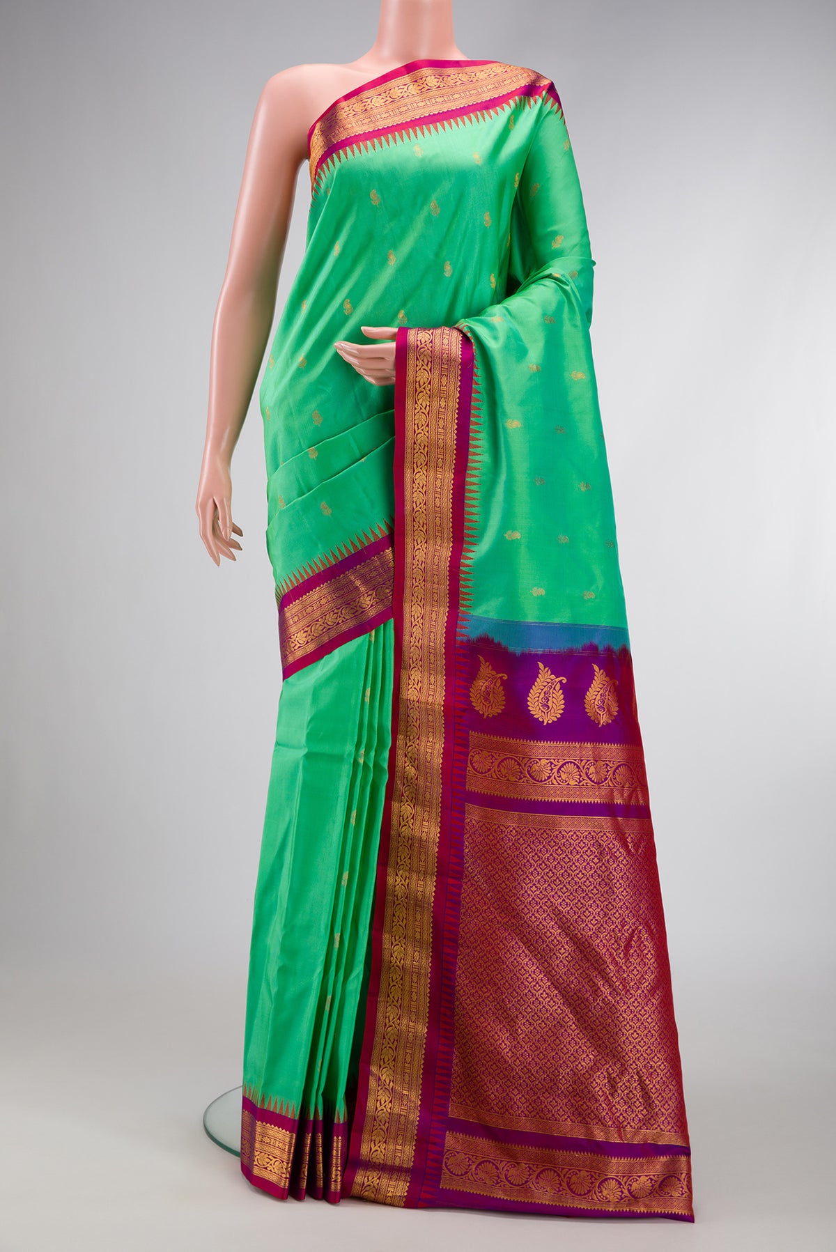 Sea Green Dual Tone Gadwal Silk Saree with Zari Butta on the body and Zari Border.  displayed on a mannequin