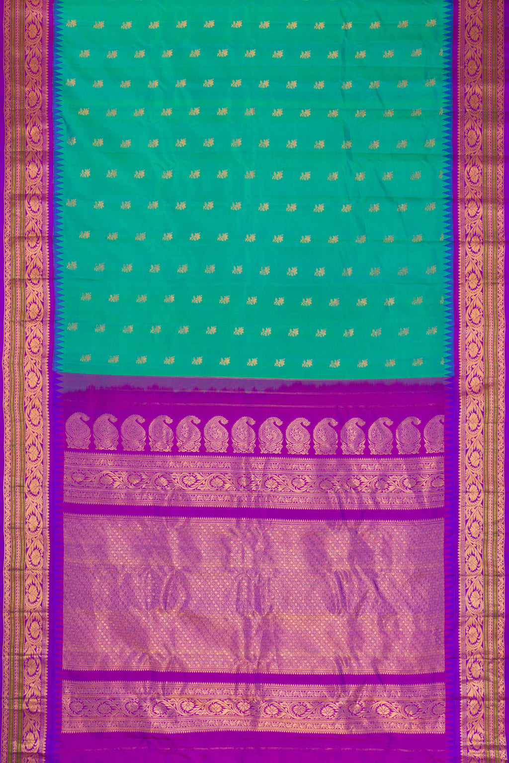 Flat view of Sea Green Dual Tone Gadwal Silk Saree with Zari Butta on the body and Zari Border. 