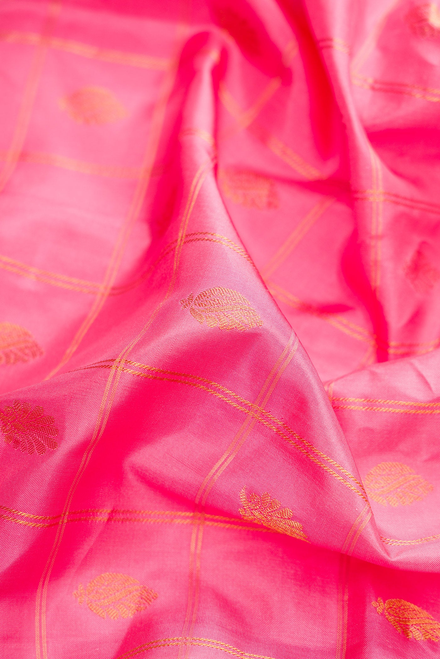 Close up of Pink Dual Tone Gadwal Silk Saree with Checked design on the body and Zari Border.  displaying folds