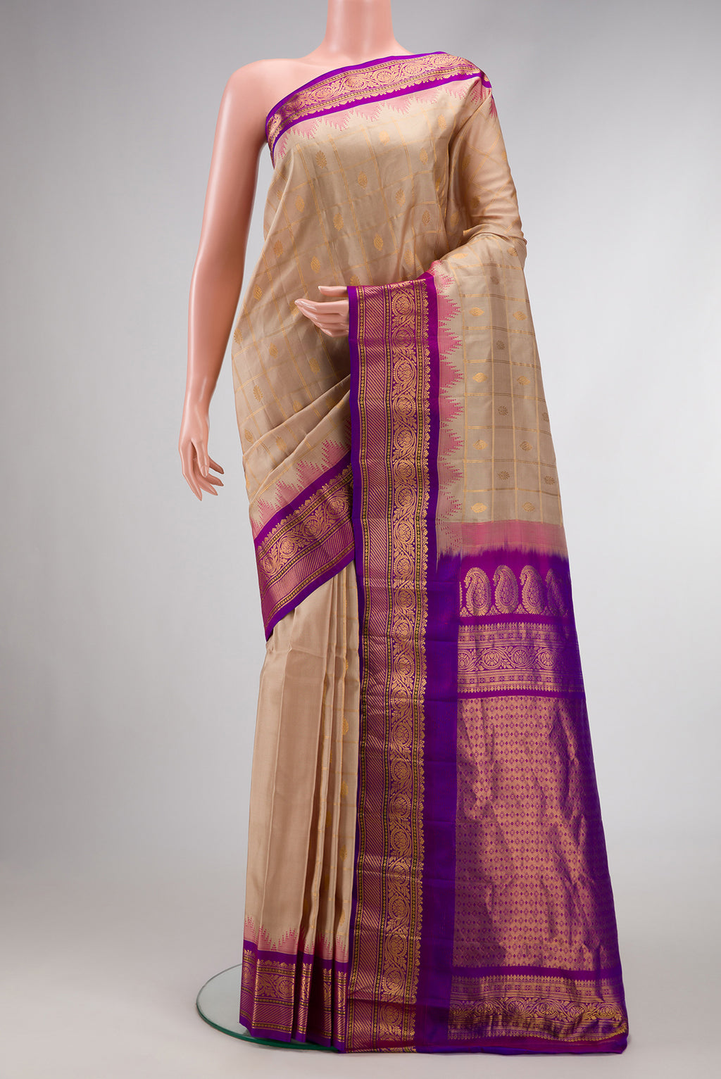 Beige Dual Tone Gadwal Silk Saree with Checked design on the body and Temple Border.  displayed on a mannequin