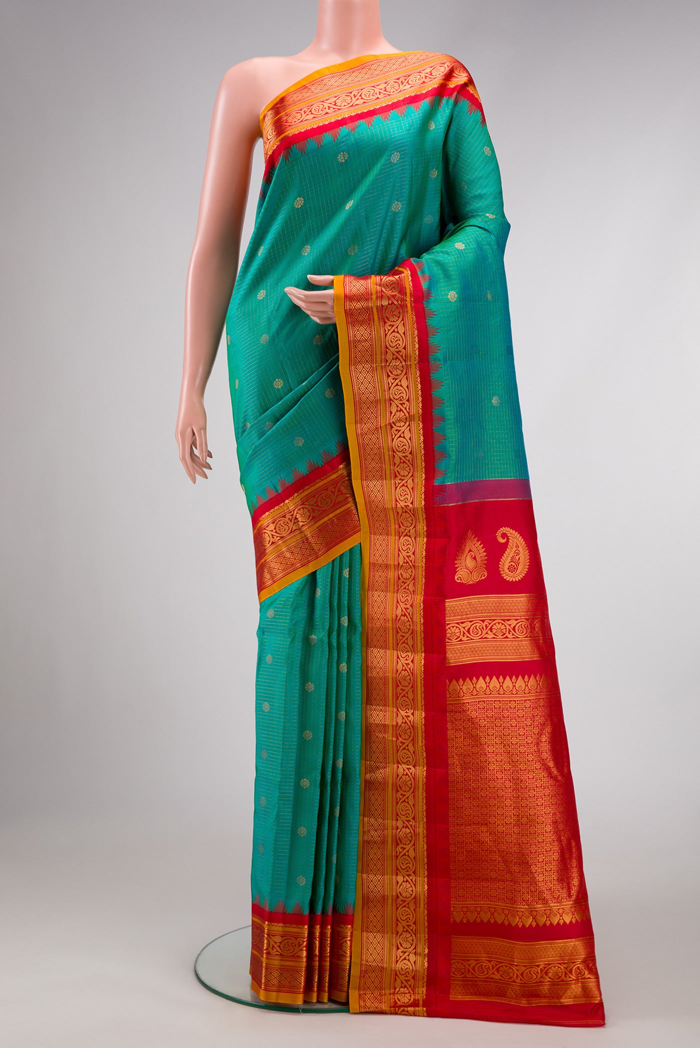 Green Dual Tone Gadwal Silk Saree with Zari Butta on the body and Zari Border.  displayed on a mannequin