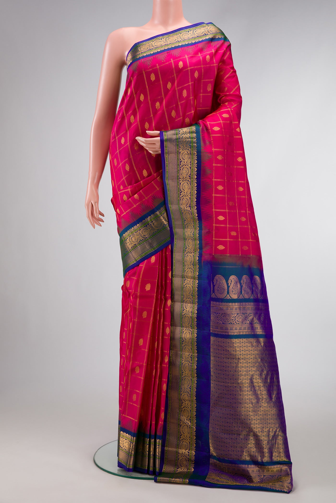 Pink Dual Tone Gadwal Silk Saree with Checked design on the body and Temple Border.  displayed on a mannequin