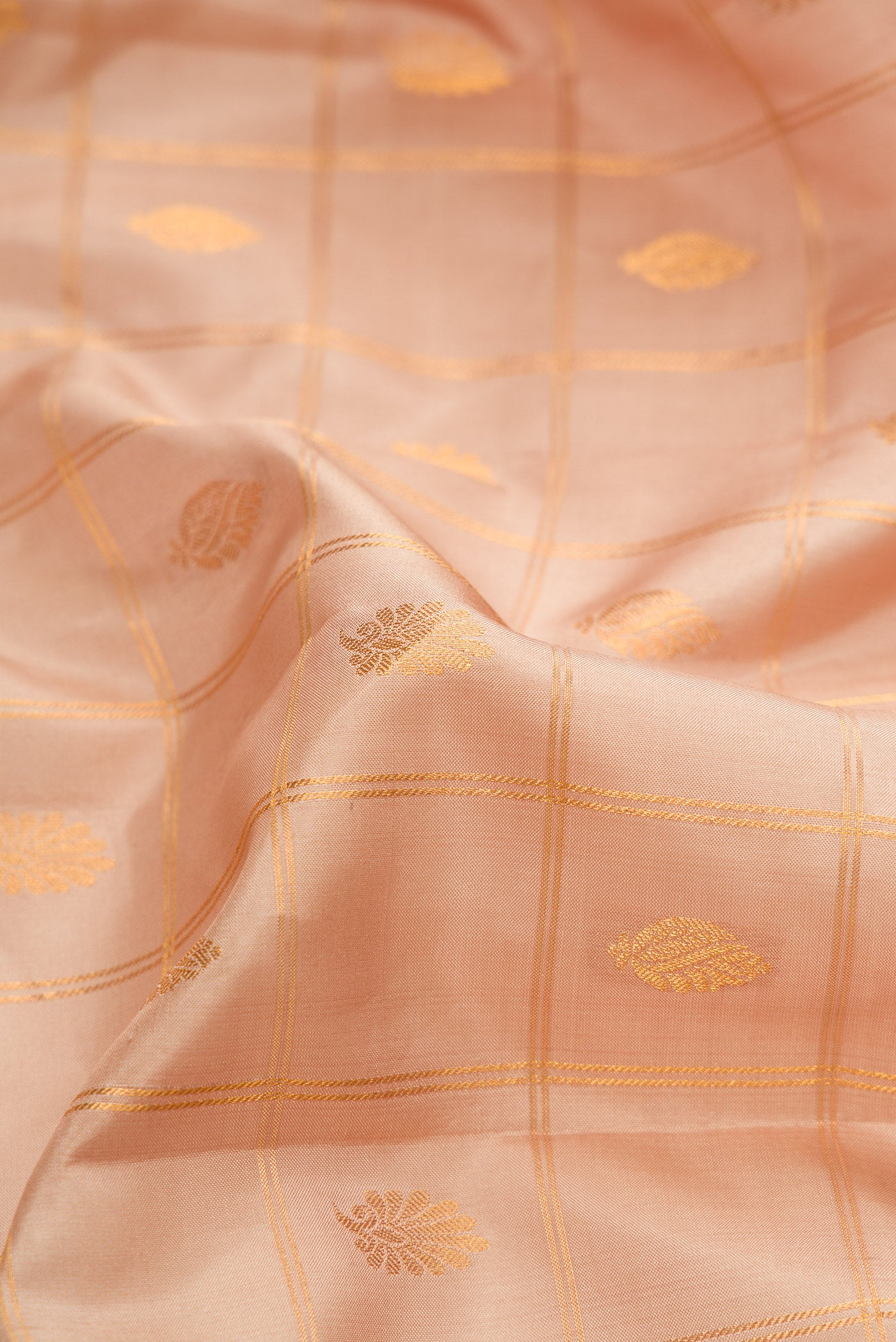 Close up of Beige Dual Tone Gadwal Silk Saree with Checked design on the body and Zari Border.  displaying folds