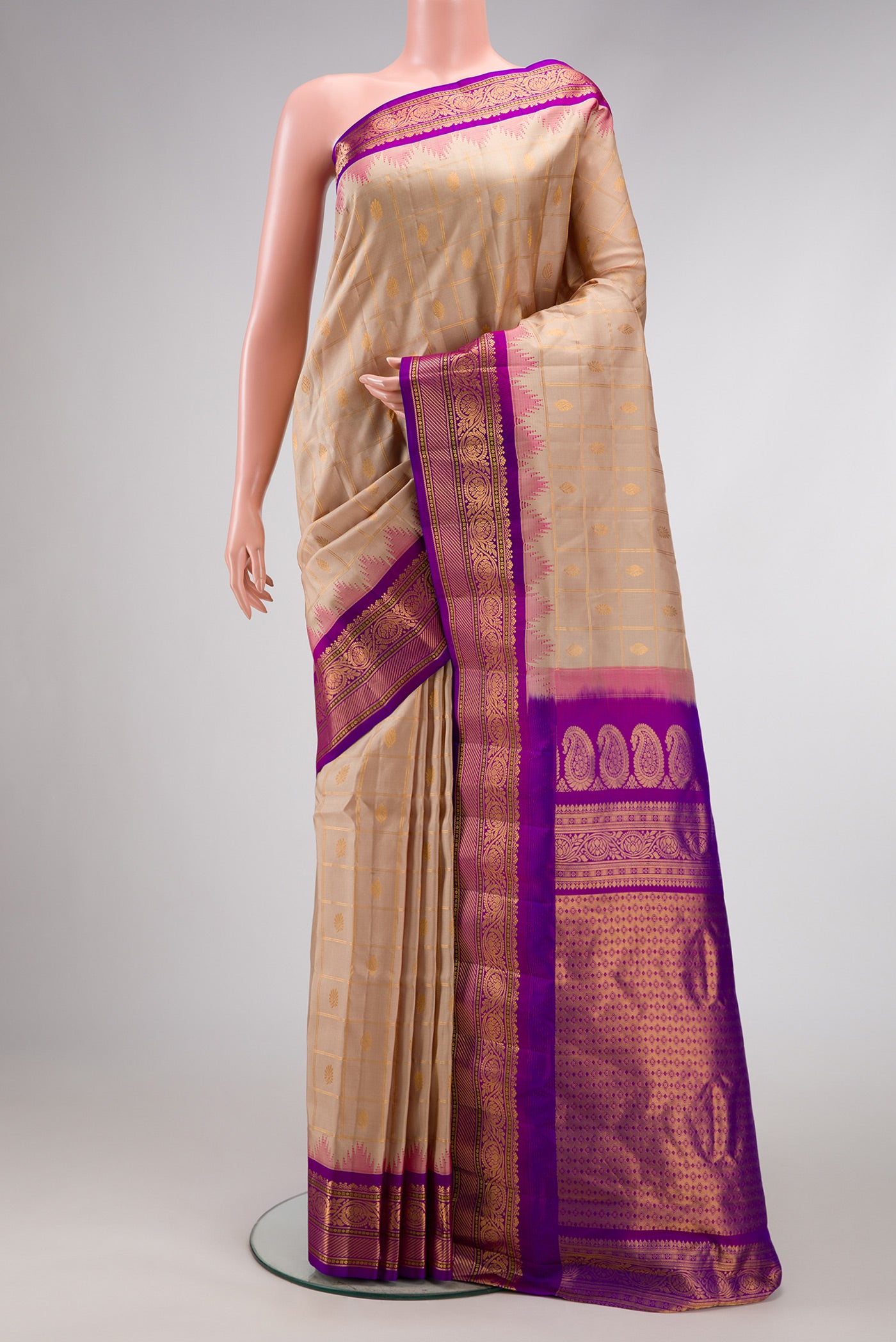Beige Dual Tone Gadwal Silk Saree with Checked design on the body and Zari Border.  displayed on a mannequin