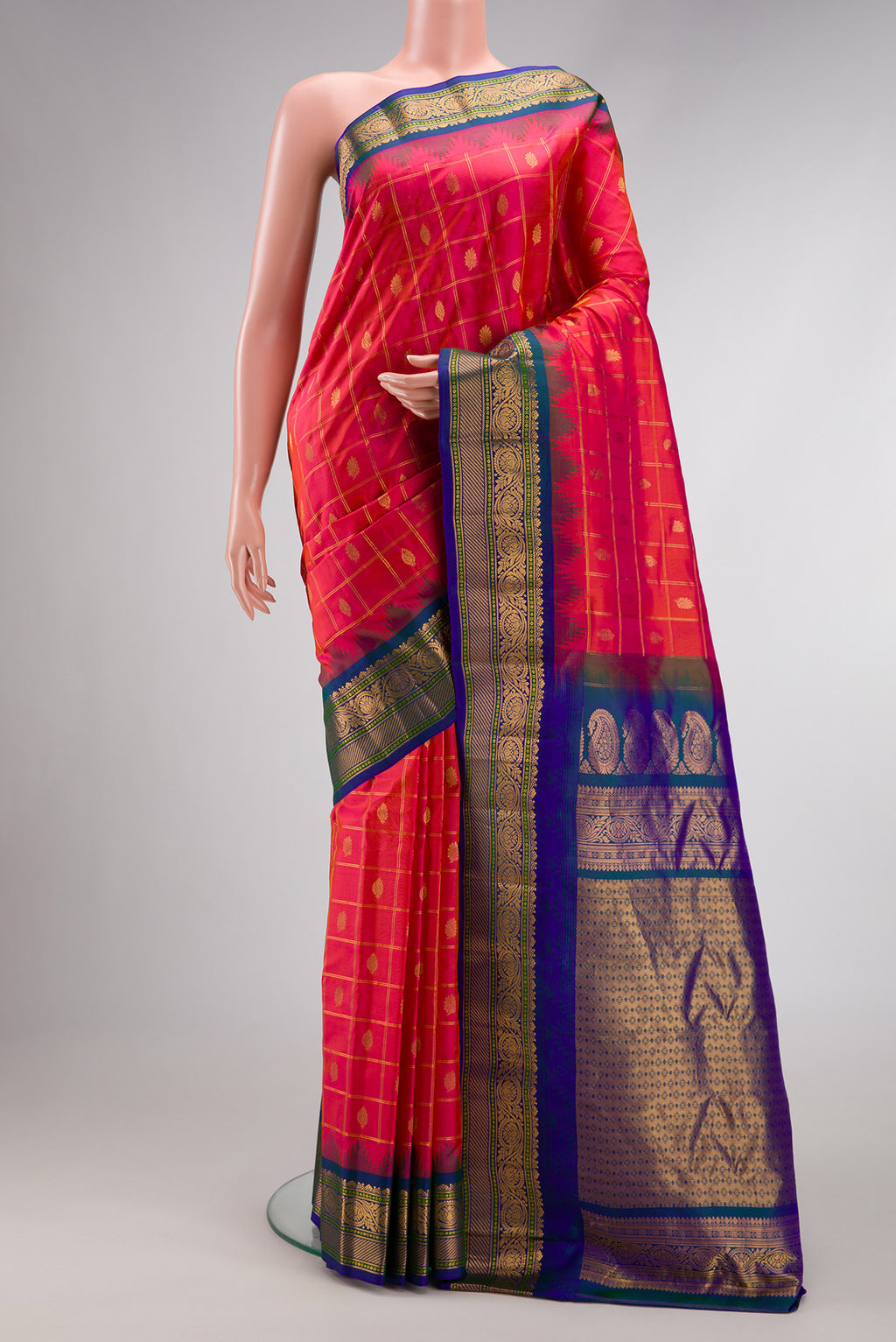 Coral Dual Tone Gadwal Silk Saree with Zari Butta on the body and Zari Border.  displayed on a mannequin