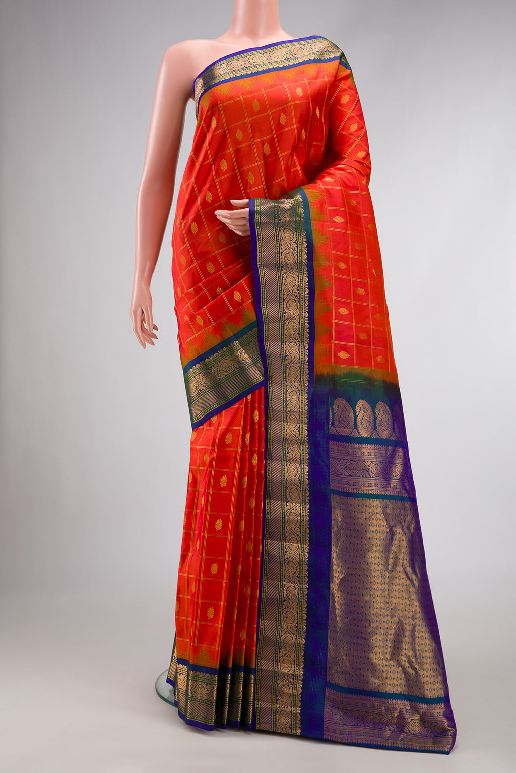 Brick Orange Dual Tone Gadwal Silk Saree with Zari Butta on the body and Zari Border.  displayed on a mannequin