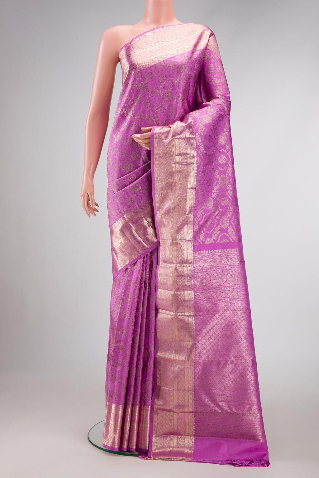 Lavender Dual Tone Kanchipuram Silk Saree with Zari Brocade on the body and Zari Border.  displayed on a mannequin