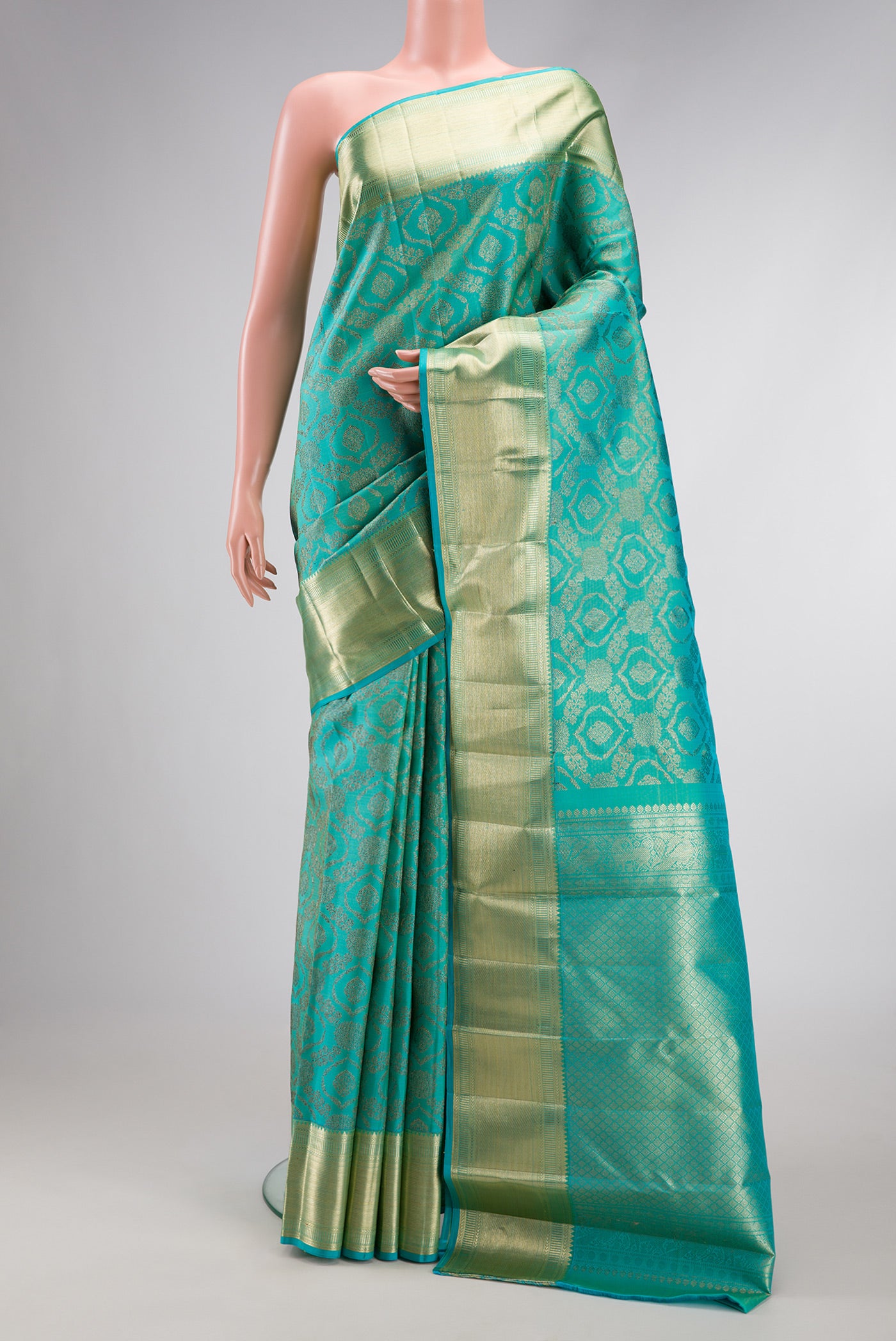 Sky Blue Dual Tone Kanchipuram Silk Saree with Zari Brocade on the body and Zari Border.  displayed on a mannequin