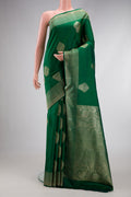 Bottle Green Dual Tone Kanjivaram Silk Saree with Zari Butta on the body and Zari Border.  displayed on a mannequin