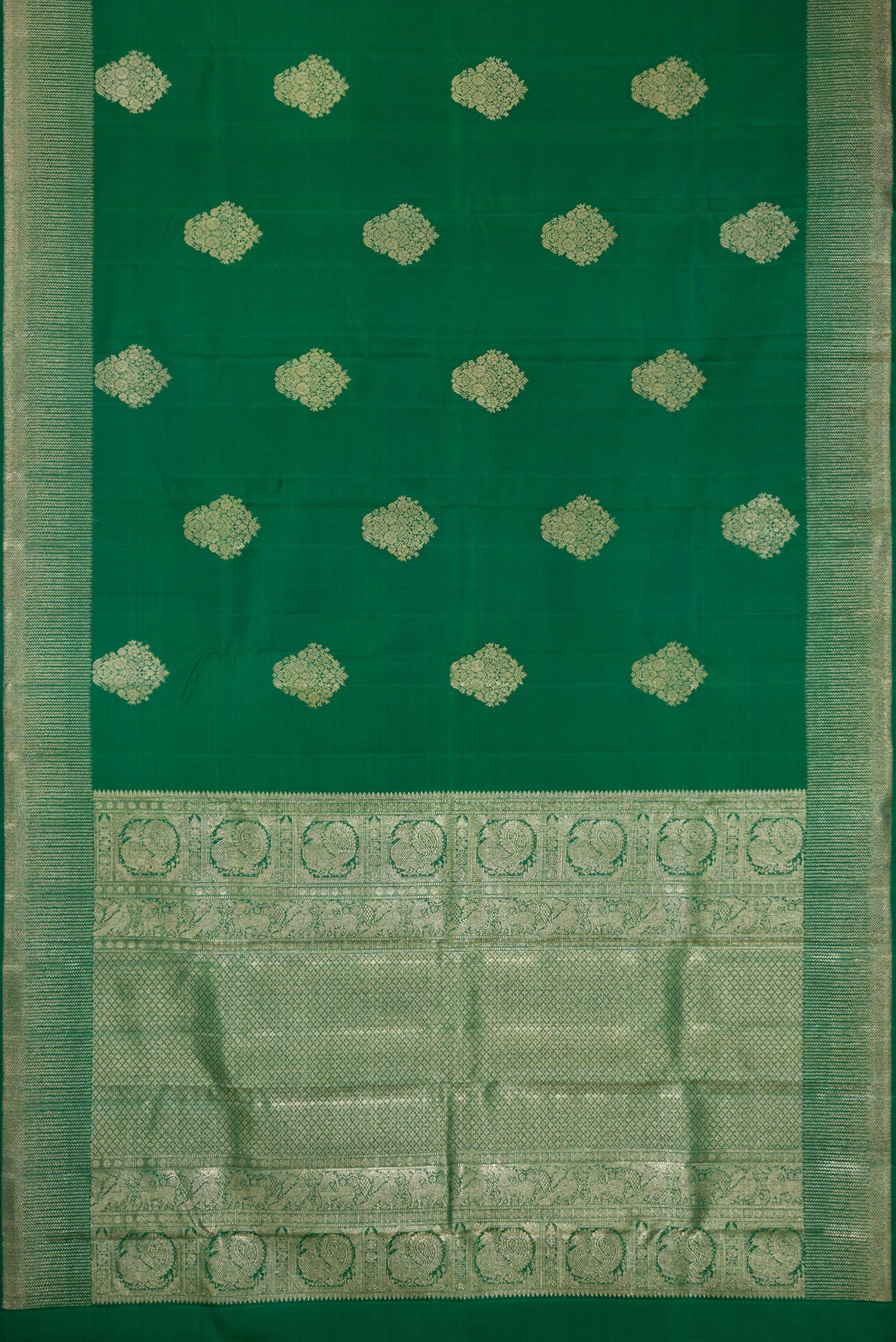Flat view of Bottle Green Dual Tone Kanjivaram Silk Saree with Zari Butta on the body and Zari Border. 