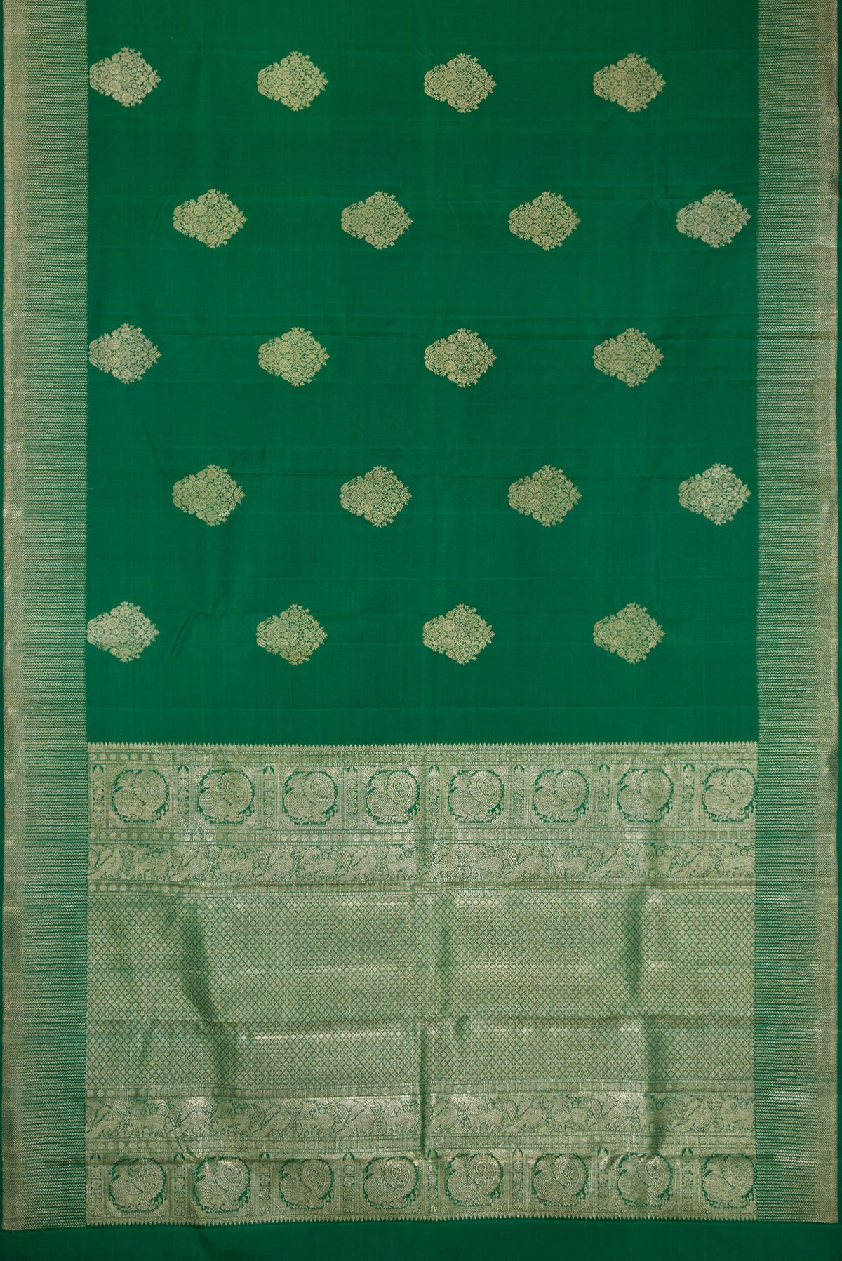 Flat view of Bottle Green Dual Tone Kanjivaram Silk Saree with Zari Butta on the body and Zari Border. 