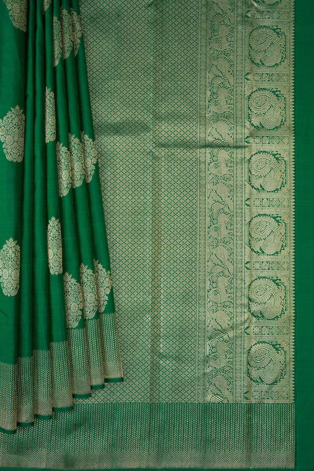 Pleats and pallu of Bottle Green Dual Tone Kanjivaram Silk Saree with Zari Butta on the body and Zari Border. 