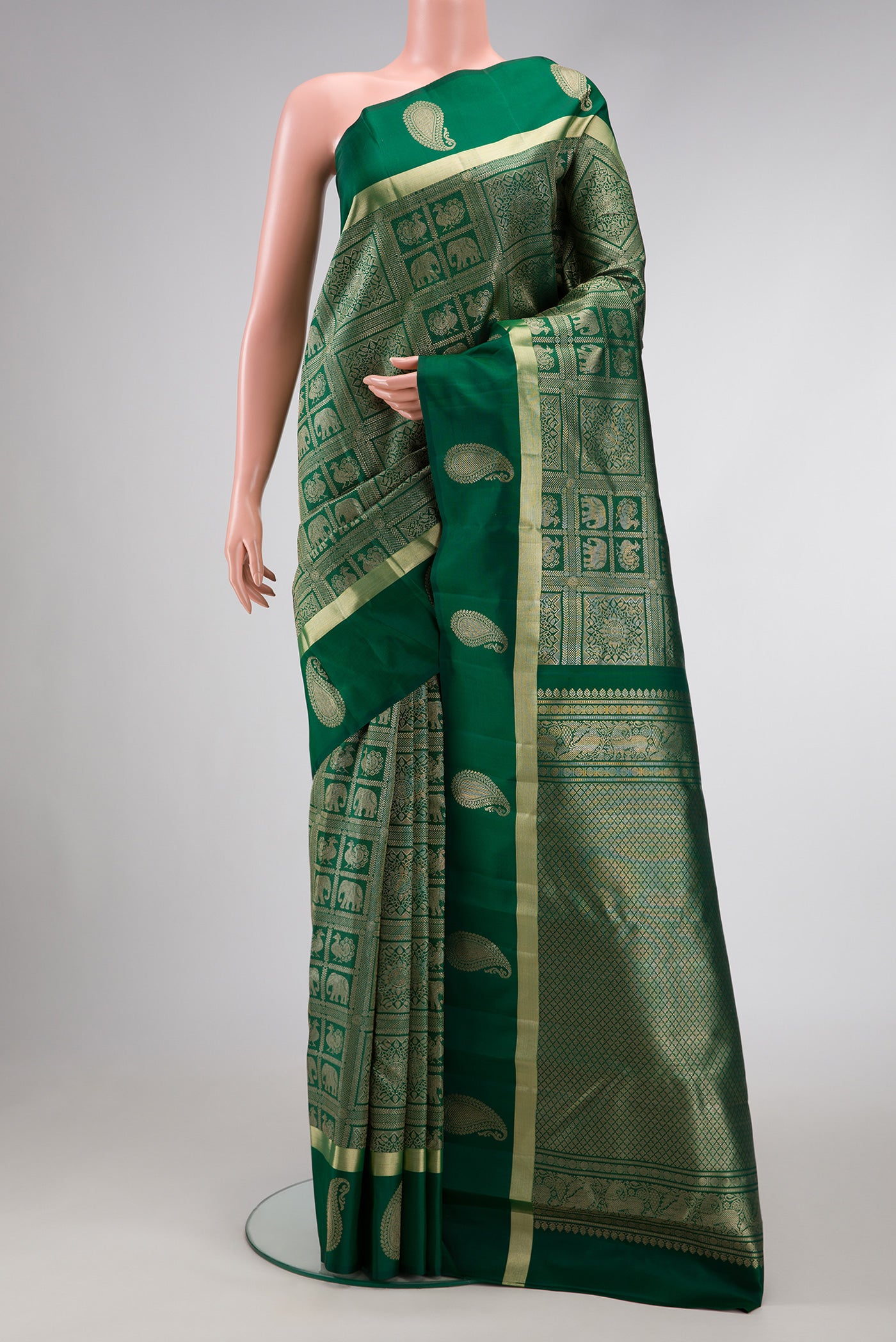 Green Dual Tone Kanchipuram Silk Saree with Zari Brocade on the body and Fancy Border.  displayed on a mannequin
