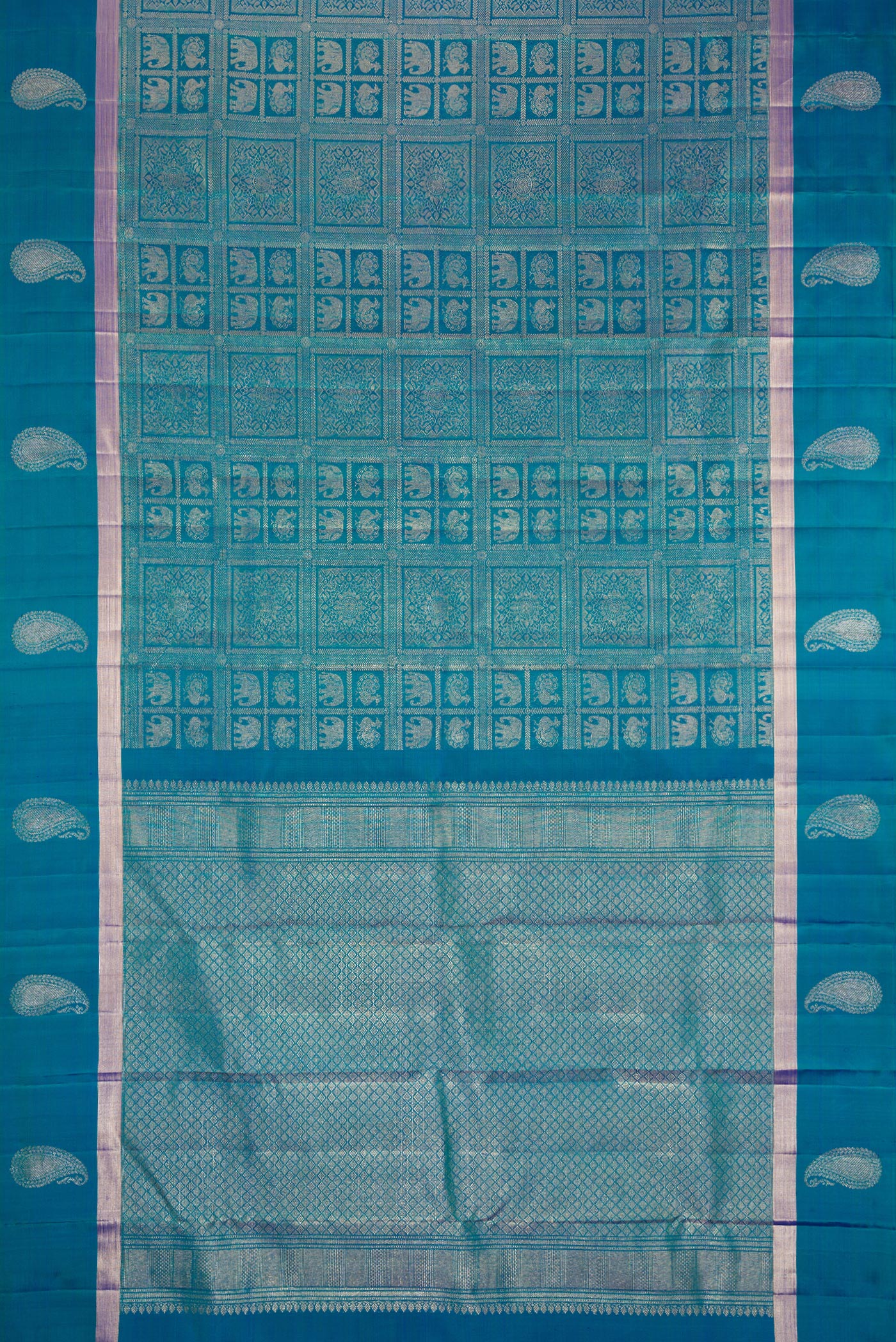 Flat view of Peacock Blue Dual Tone Kanchipuram Silk Saree with Zari Brocade on the body and Zari Border. 