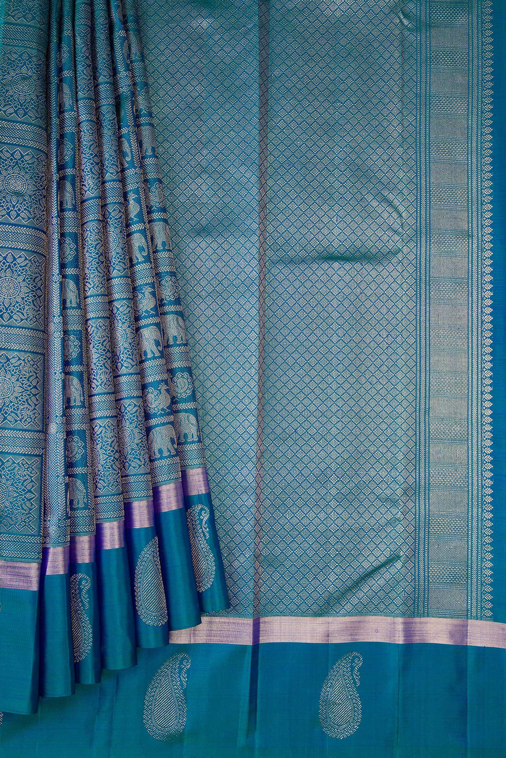Pleats and pallu of Peacock Blue Dual Tone Kanchipuram Silk Saree with Zari Brocade on the body and Zari Border. 