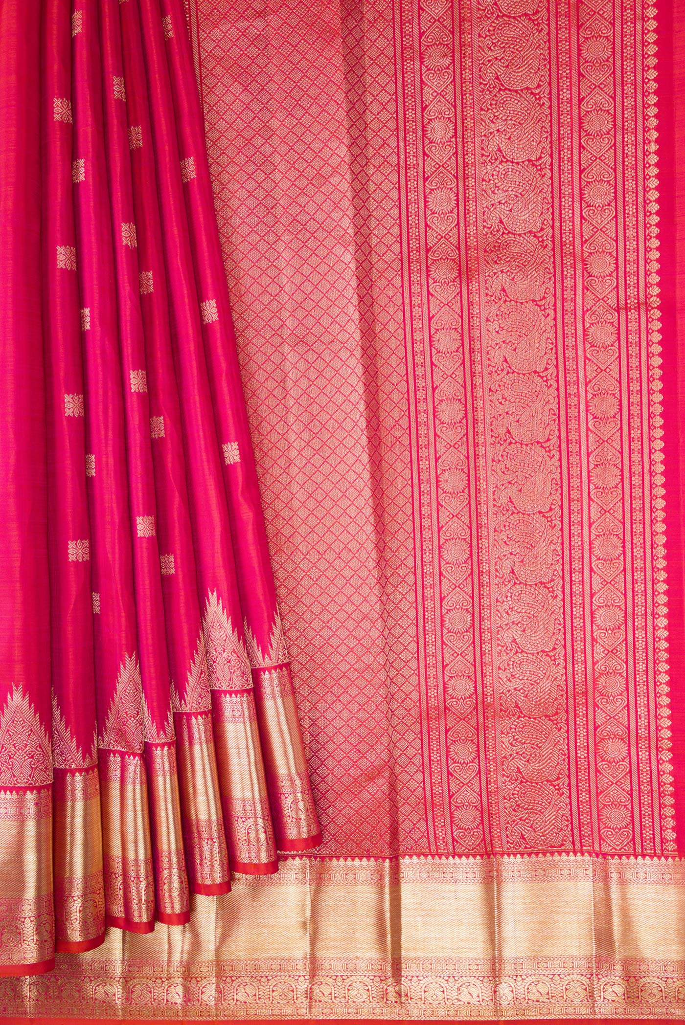 Pleats and pallu of Coral Dual Tone Kanjivaram Silk Saree with Zari Butta on the body and Fancy Border. 