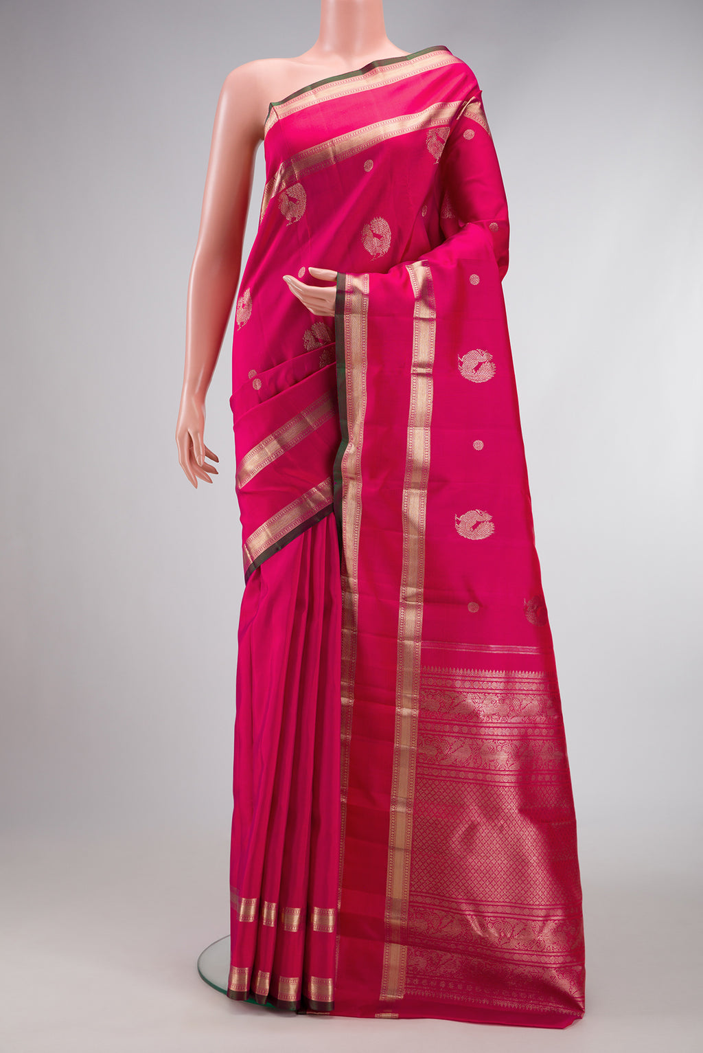 Pink Dual Tone Kanjivaram Silk Saree with Zari Butta on the body and Zari Border.  displayed on a mannequin