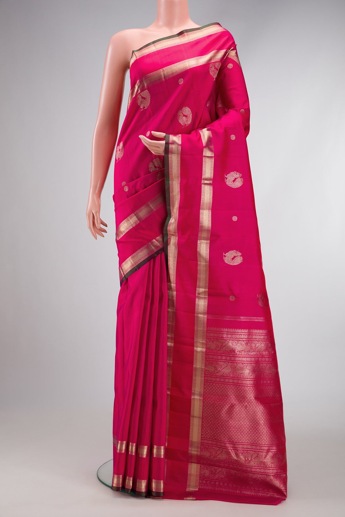 Pink Dual Tone Kanjivaram Silk Saree with Zari Butta on the body and Zari Border.  displayed on a mannequin
