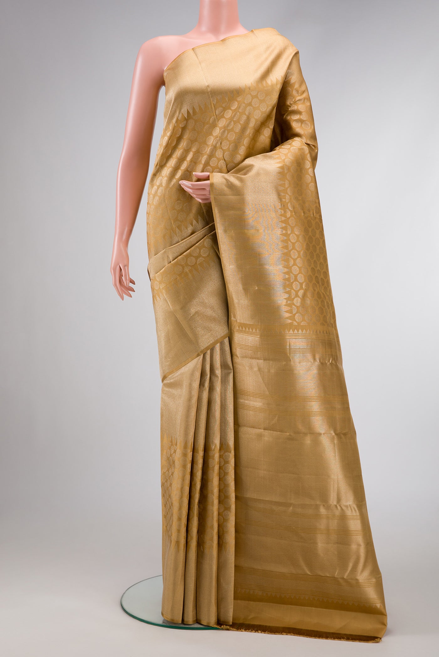 Gold Dual Tone Kanchipuram Silk Saree with Zari Brocade on the body and Temple Border.  displayed on a mannequin