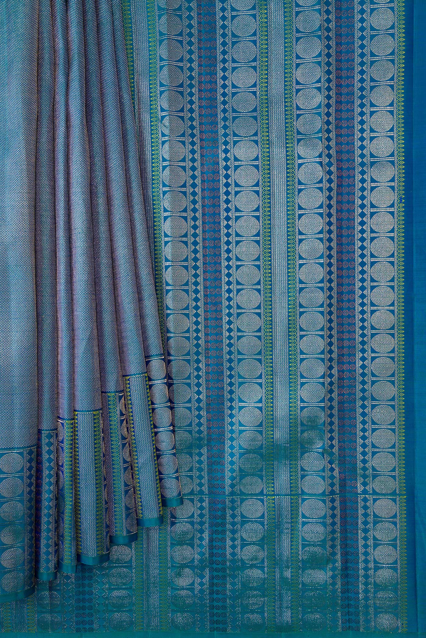 Pleats and pallu of Peacock Blue Dual Tone Kanchipuram Silk Saree with Zari Brocade on the body and Fancy Border. 