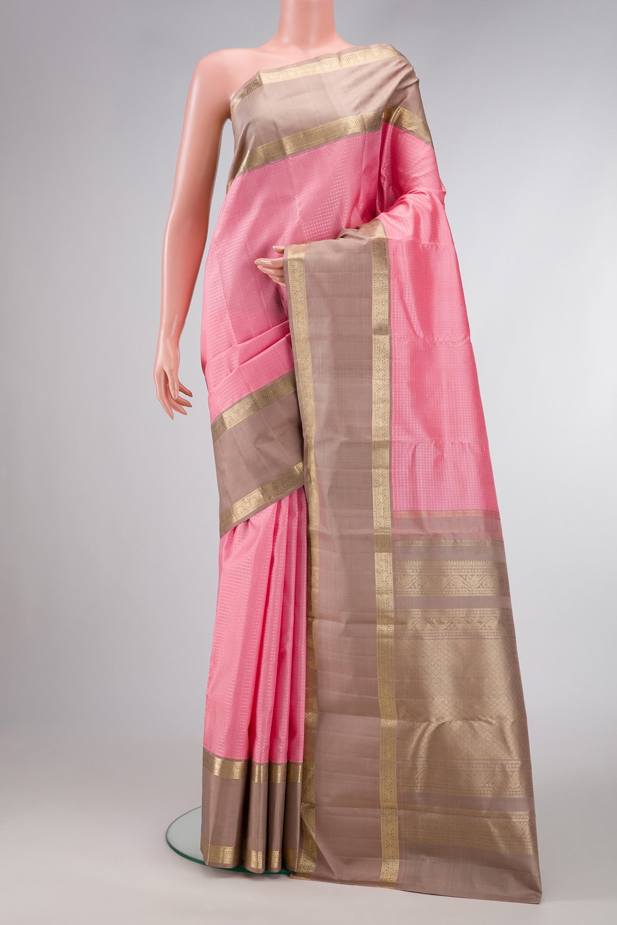 Pink Dual Tone Kanjivaram Silk Saree with Zari Butta on the body and Zari Border.  displayed on a mannequin