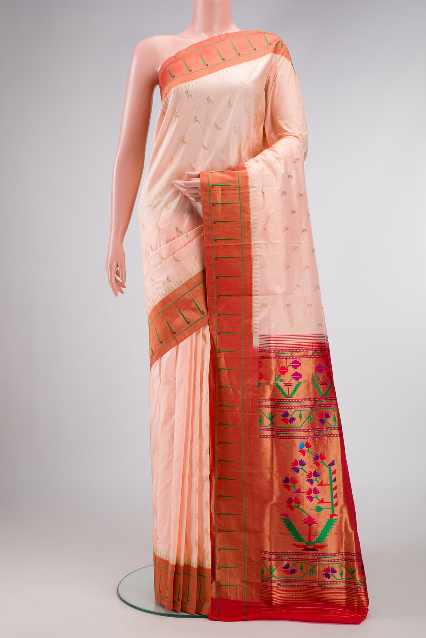 Peach Dual Tone Paithani Silk Saree with Zari Butta on the body and Paithani Border.  displayed on a mannequin
