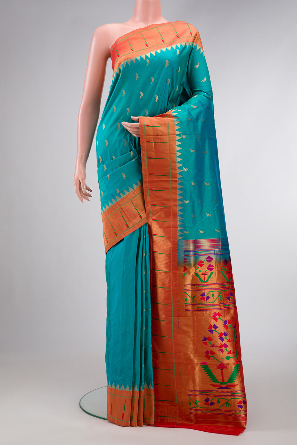 Green Dual Tone Paithani Silk Saree with Zari Butta on the body and Paithani Border.  displayed on a mannequin