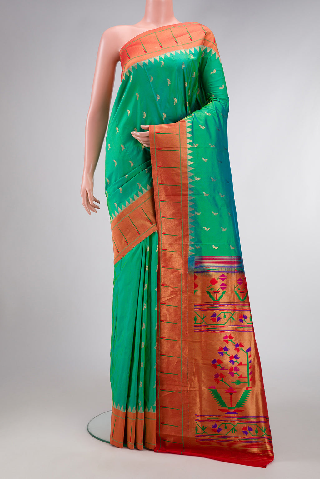 Green Dual Tone Paithani Silk Saree with Zari Butta on the body and Paithani Border.  displayed on a mannequin