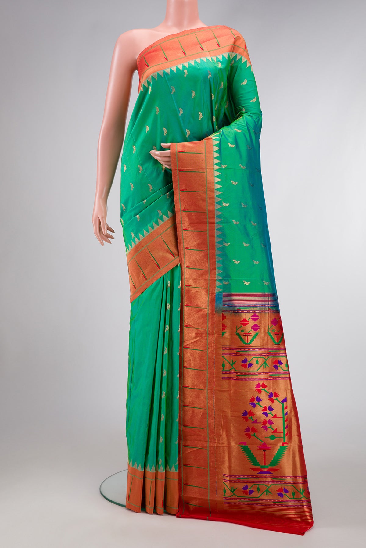 Green Dual Tone Paithani Silk Saree with Zari Butta on the body and Paithani Border.  displayed on a mannequin