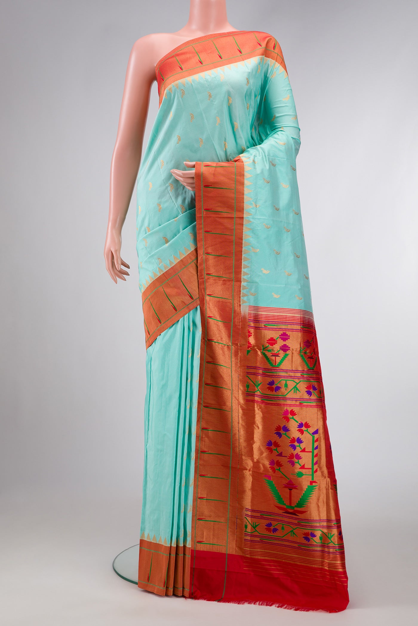Light Blue Dual Tone Paithani Silk Saree with Zari Butta on the body and Paithani Border.  displayed on a mannequin