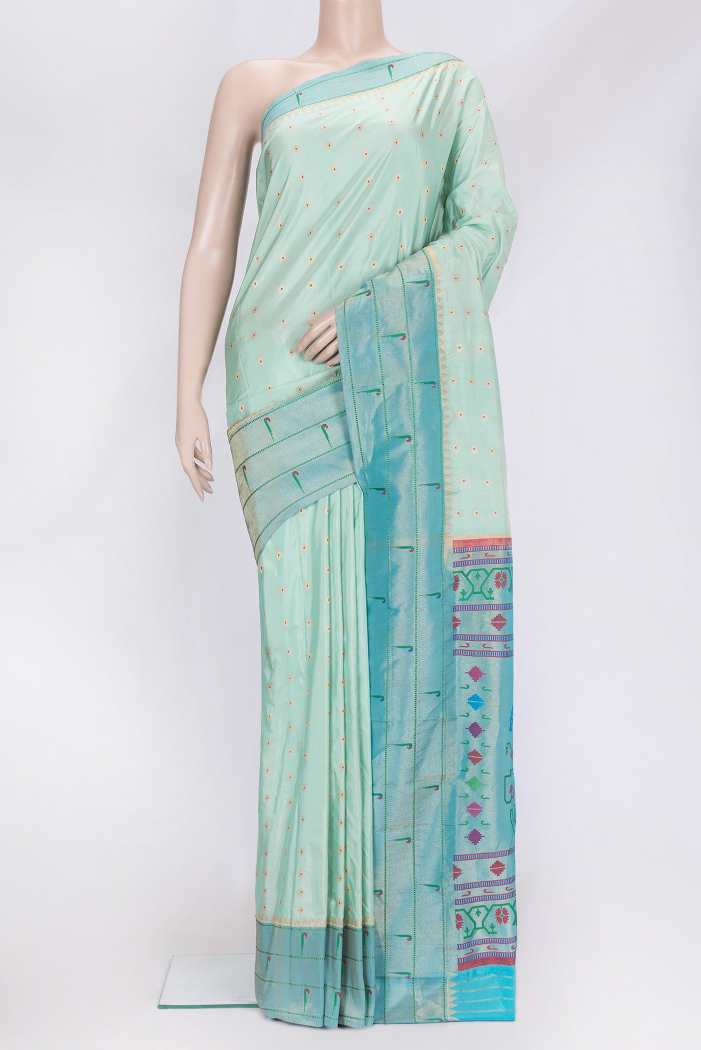 Sea Green Dual Tone Paithani Silk Saree with Zari And Thread Butta on the body and Paithani Border.  displayed on a mannequin