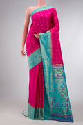 Pink Dual Tone Paithani Silk Saree with Zari Butta on the body and Paithani Border.  displayed on a mannequin
