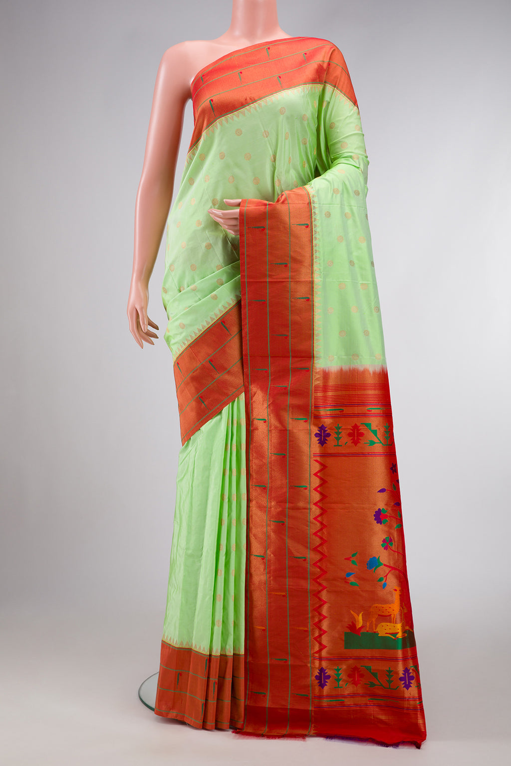 Light Green Dual Tone Paithani Silk Saree with Zari Butta on the body and Paithani Border.  displayed on a mannequin