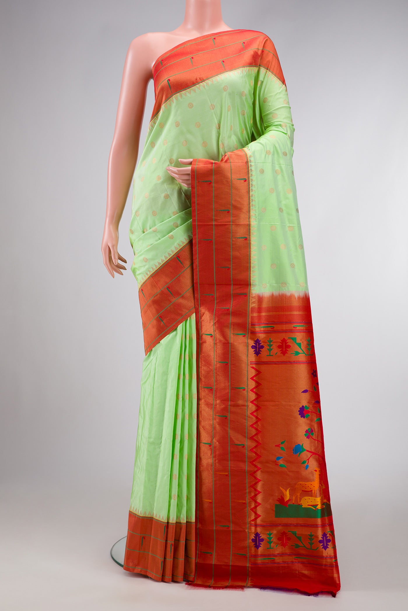 Light Green Dual Tone Paithani Silk Saree with Zari Butta on the body and Paithani Border.  displayed on a mannequin
