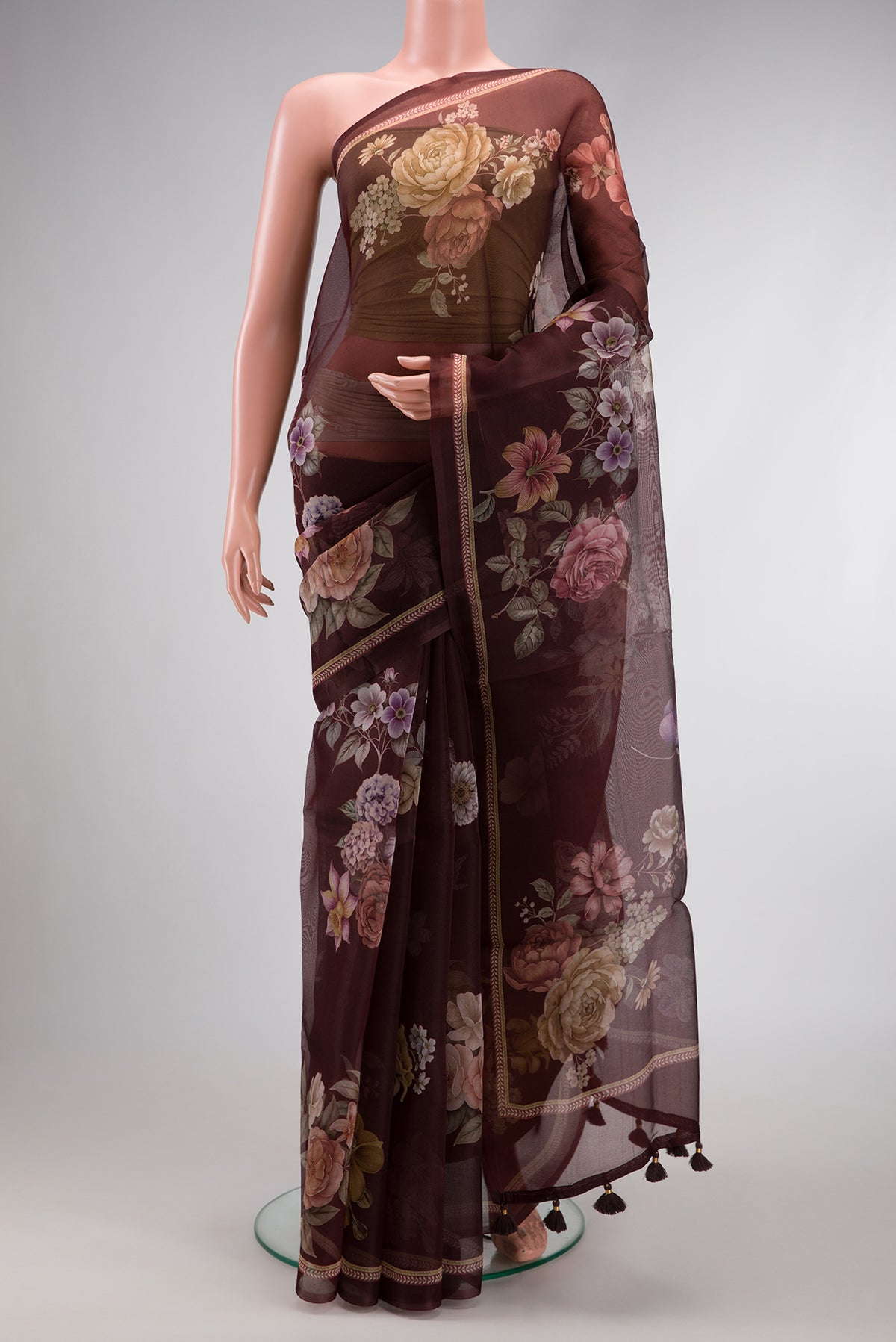 Brown Dual Tone Organza Silk Saree with Printed design on the body and Printed Border.  displayed on a mannequin